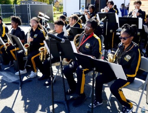 Youth jazz band performing at an outdoor event