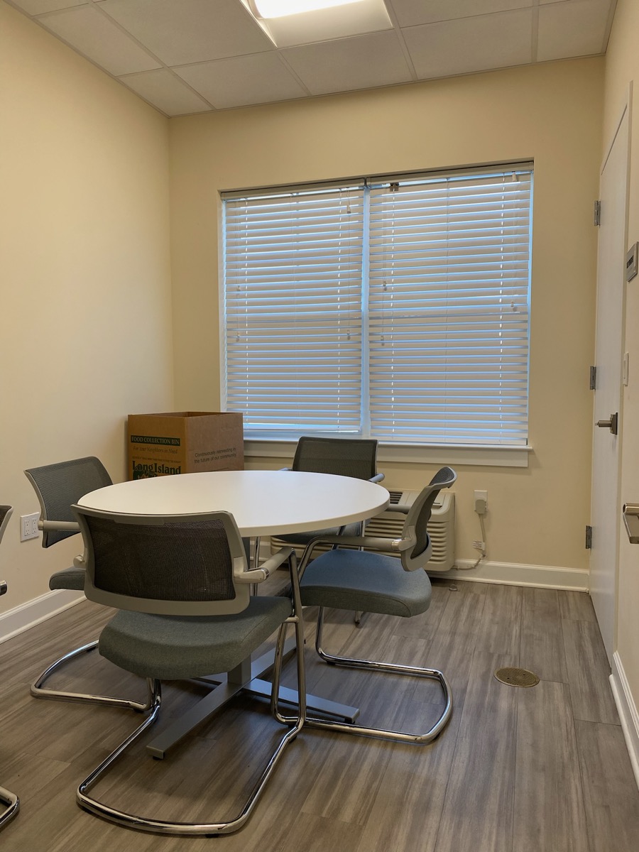 Meeting Room C round table and desk